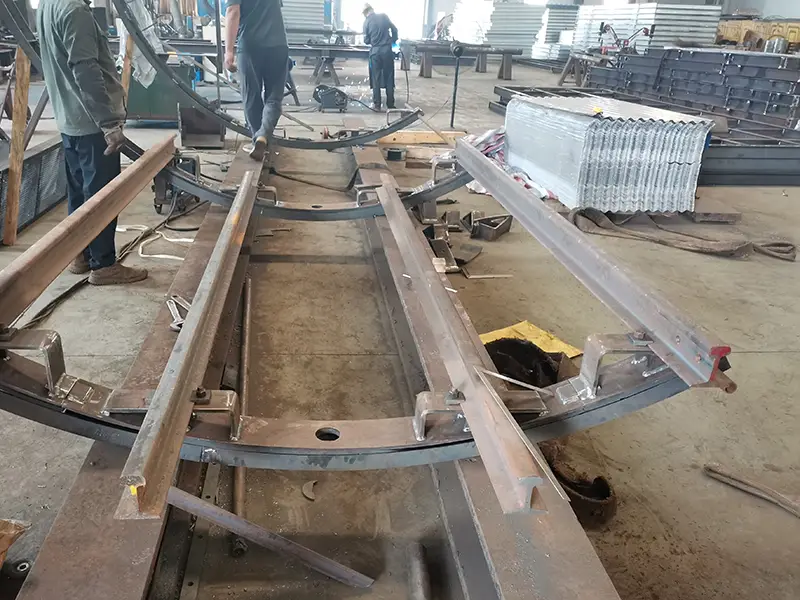 Workshop simulation of 22kg steel rail installation with tunnel support structure