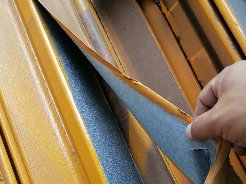 Protective film covering A65 crane rail head top surface to prevent paint on running surface
