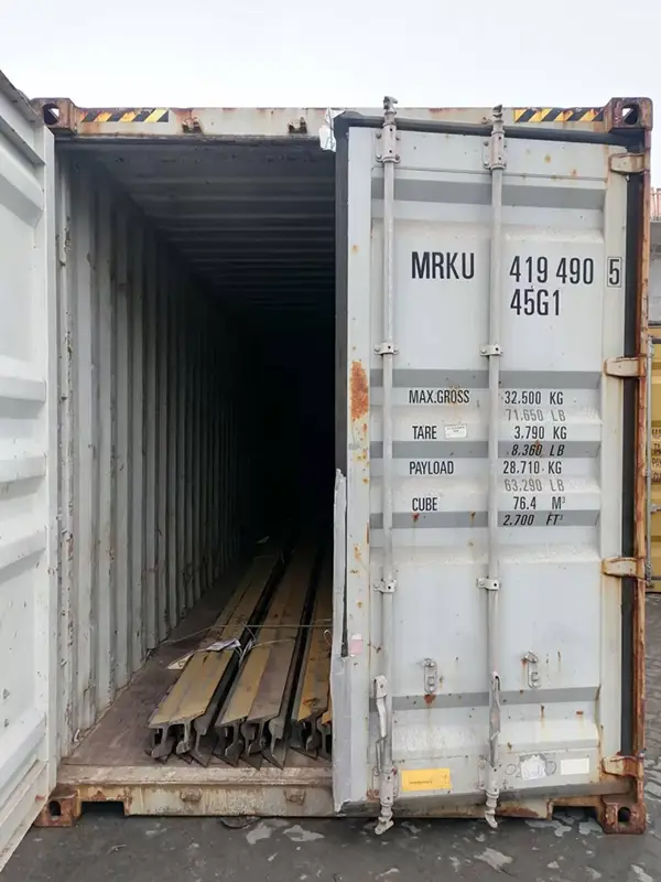 S49 steel rails loaded in shipping container before door closure at Tianjin port